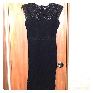 Fitted black lace dress